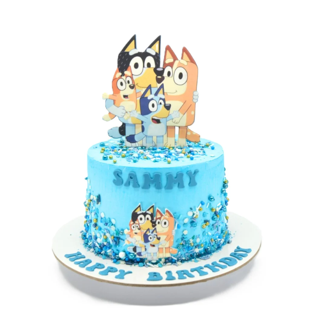 Bluey birthday cake with blue frosting, character topper, edible image, sprinkles, and name detail.