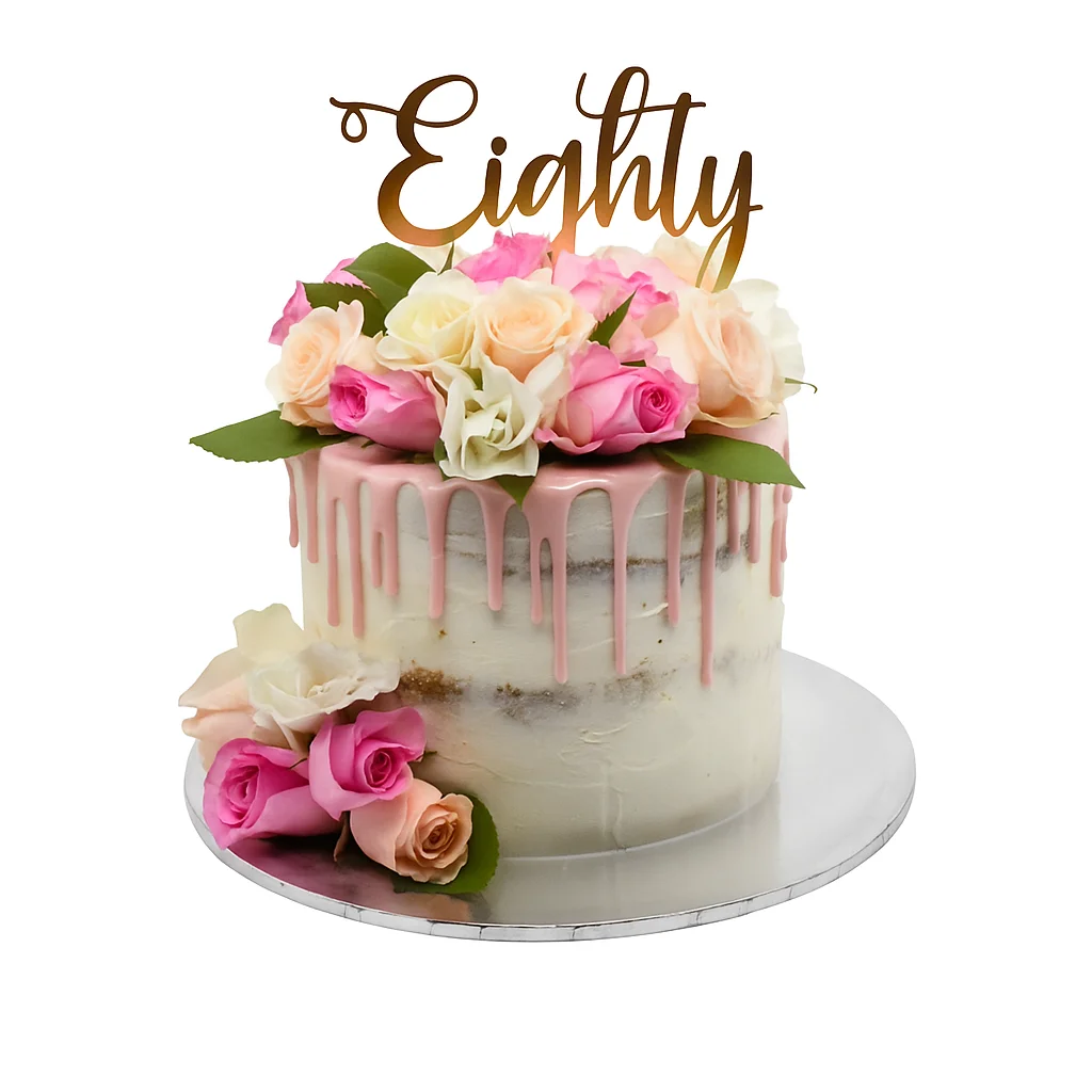 Semi-naked 80th birthday cake by Amarantos Cakes featuring white icing, pink drip glaze, fresh roses in shades of pink, peach, and white, and a cursive gold “Eighty” topper.