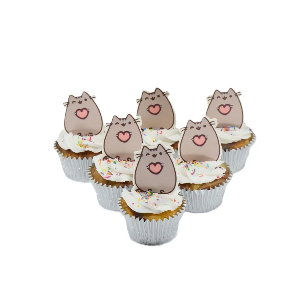 Pusheen cat cupcakes with white frosting, colourful sprinkles, and cartoon toppers in silver foil wrappers.