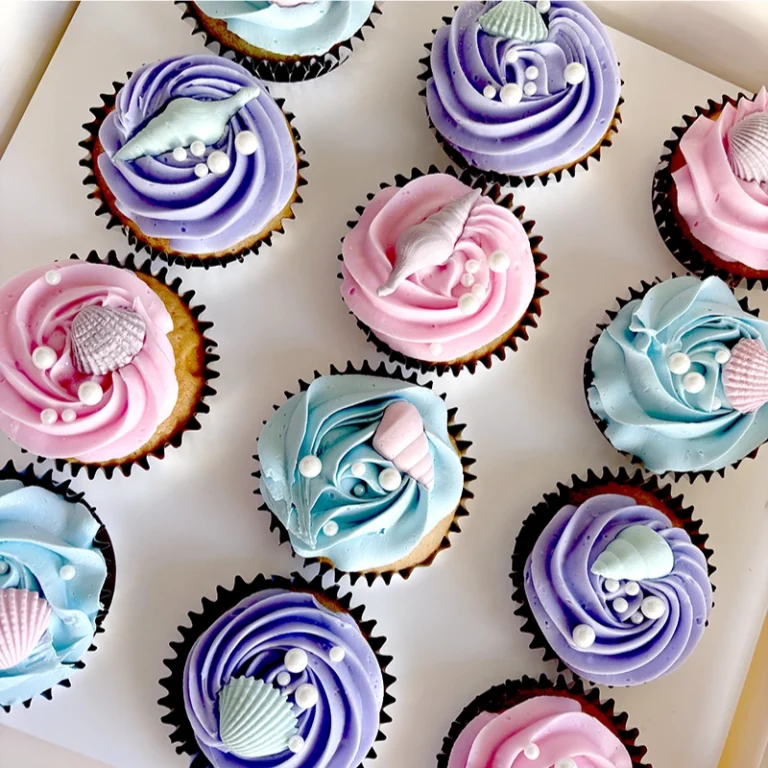 A pack of pink and purple cupcakes.