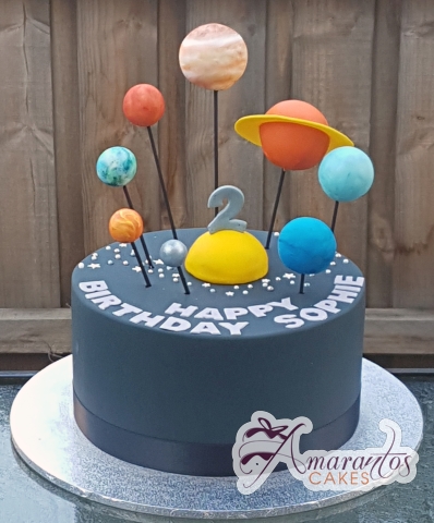 Solar system birthday cake with protruding 3D planets