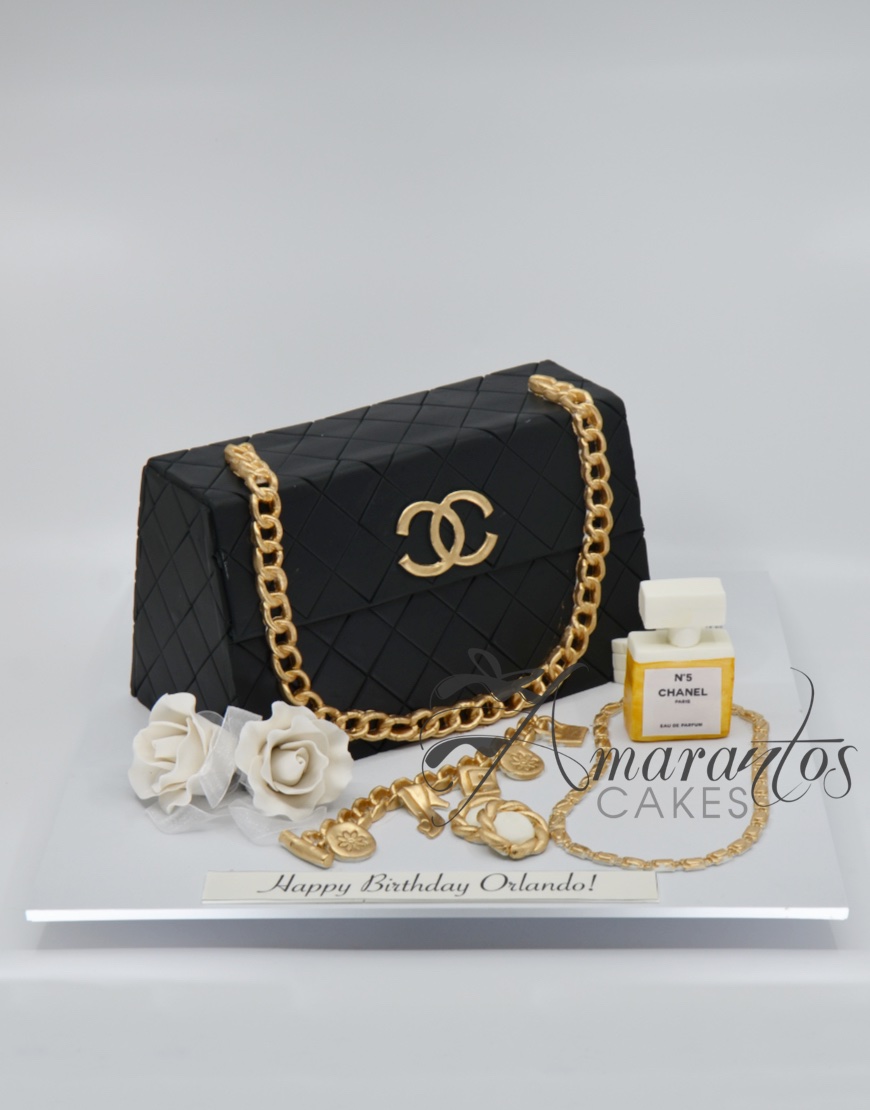 Pink Chanel birthday cake with gold chain strap.PNG